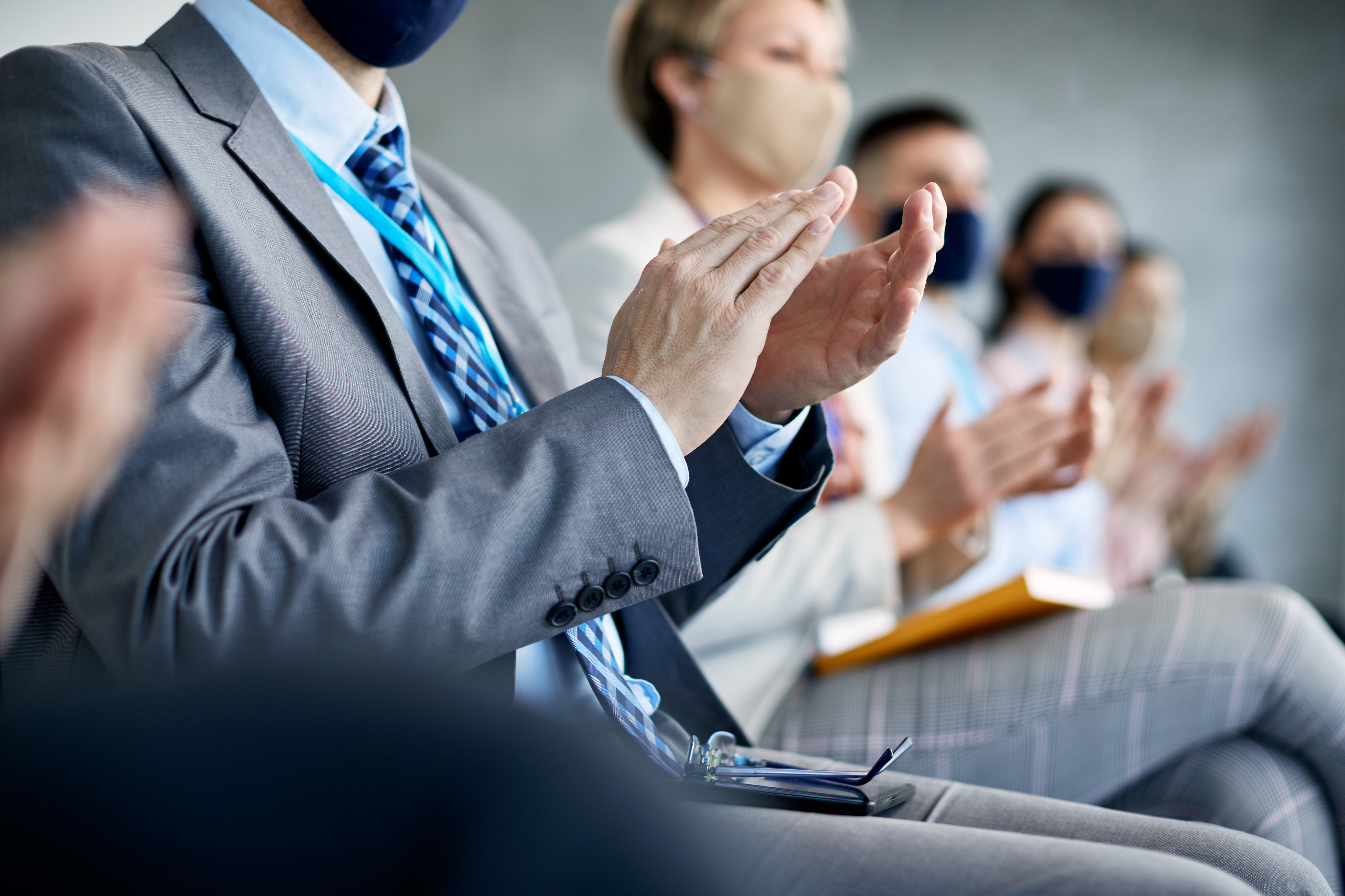 Close Up Of Entrepreneur And His Colleagues Applauding After Successful Business Presentation During Covid 19 Pandemic.